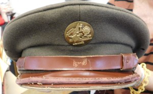 An authentic U.S. Army Garrison Cap, with a leather brim and made from 100-percent wool