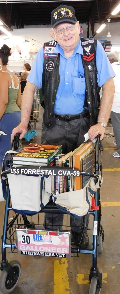 Bob Finley of Gainesville, retired from the Navy and the U.S. Postal Service, wheels his $3.10 worth of books out of the FOL Book Sale on 10-cent day.