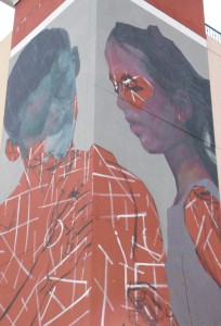 The mural by Evoca1 in its early stages on the Southwest Parking Garage.