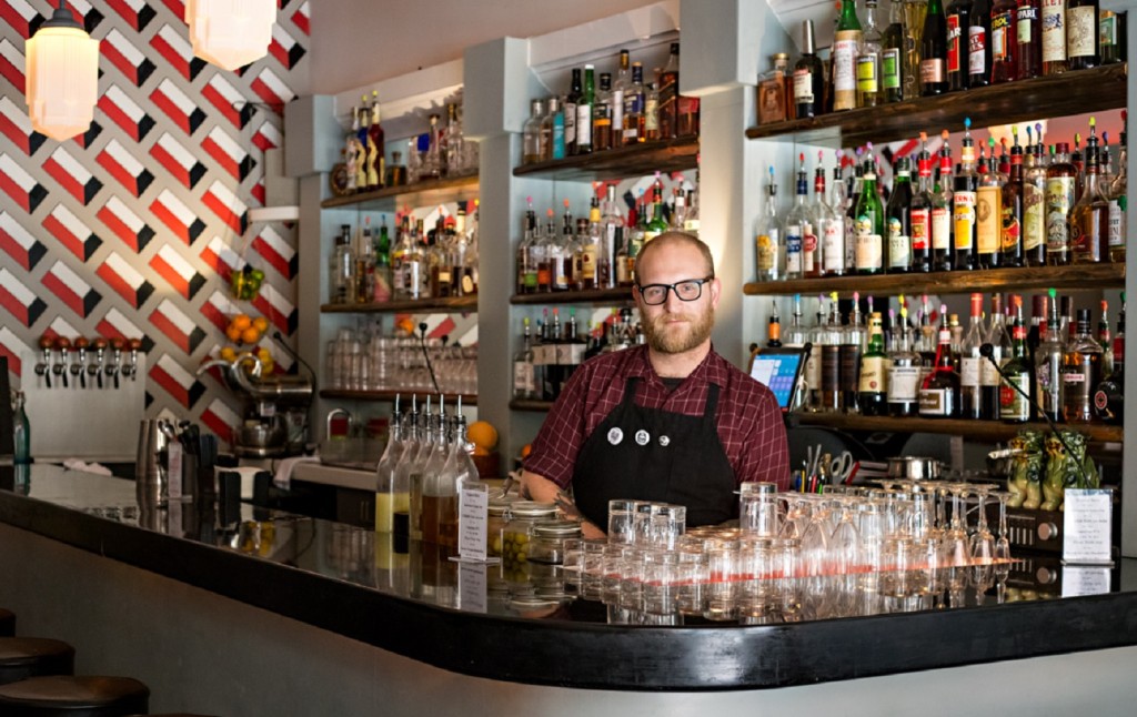 Daniel Schexnaydre behind the bar at The Dime. (Photograph by Lena Crane, Reflections of Light Photography)