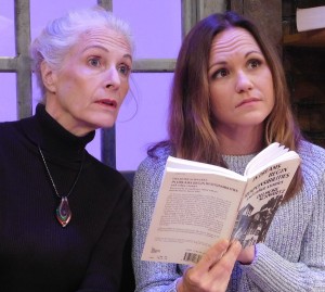 Ruth and Lisa examine a book by Delmore Schwartz.