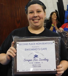 Chef Shanti Riesch and her second-place award for Emilianos Pork Chili Verde. 