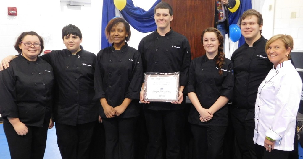 Billie DeNunzio, right, and her award-winning culinary students from Eastside High. Photo by Gainesville Downtown)