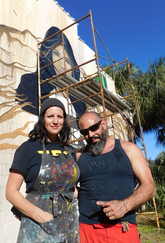 Carrie Wachter Martinez and Jesus Martinez in front of the mural they worked on at High Dive. 
