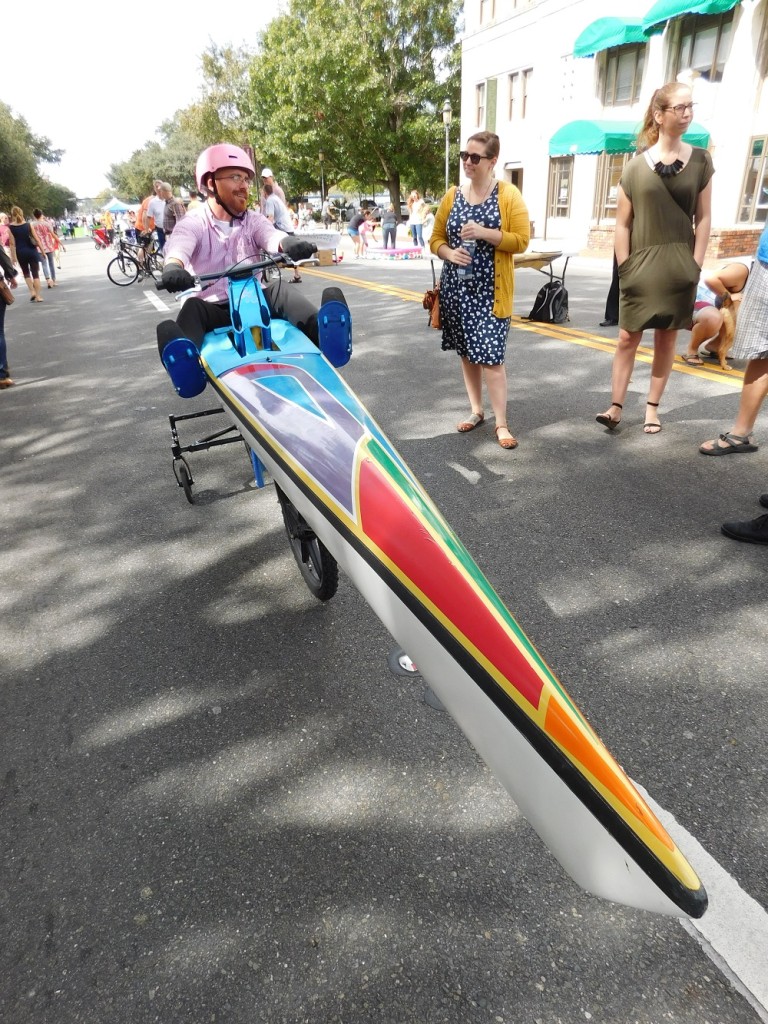 Joseph Floyd inside the BikeBoat that he and Greg Carter designed. Floyd took the pedal-powered bike for a test ride on University Avenue during the Active Streets event last fall.