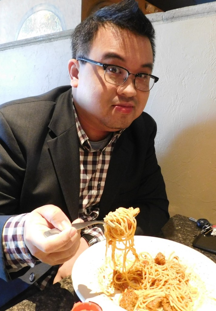 Ken Peng gets ready to chow down at Piesanos Stone Fired Pizza. Photo by Gainesville Downtown)