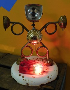 "Light-headed," by Celino Dimitroff, made of fond objects, including a 1964 Lenton bicycle headlight.