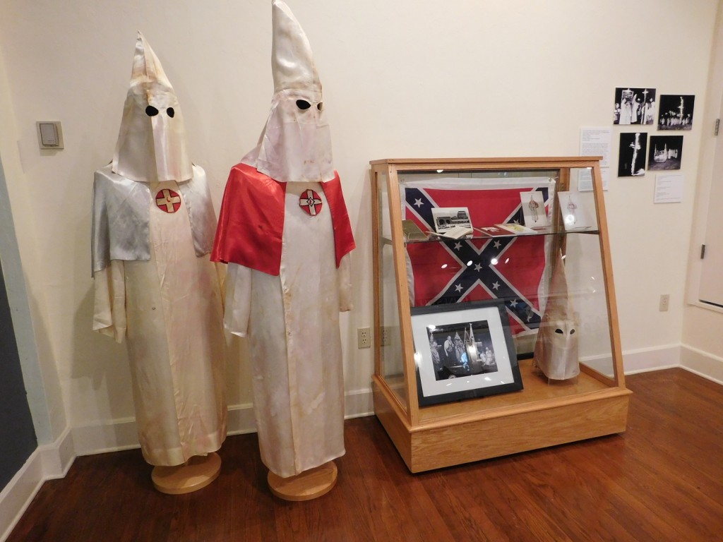 Two Ku Klux Klan outfits are a chilling reminder of the racism that was prevalent throughout the 20th century and that continues today. (Photo by Gainesville Downtown)