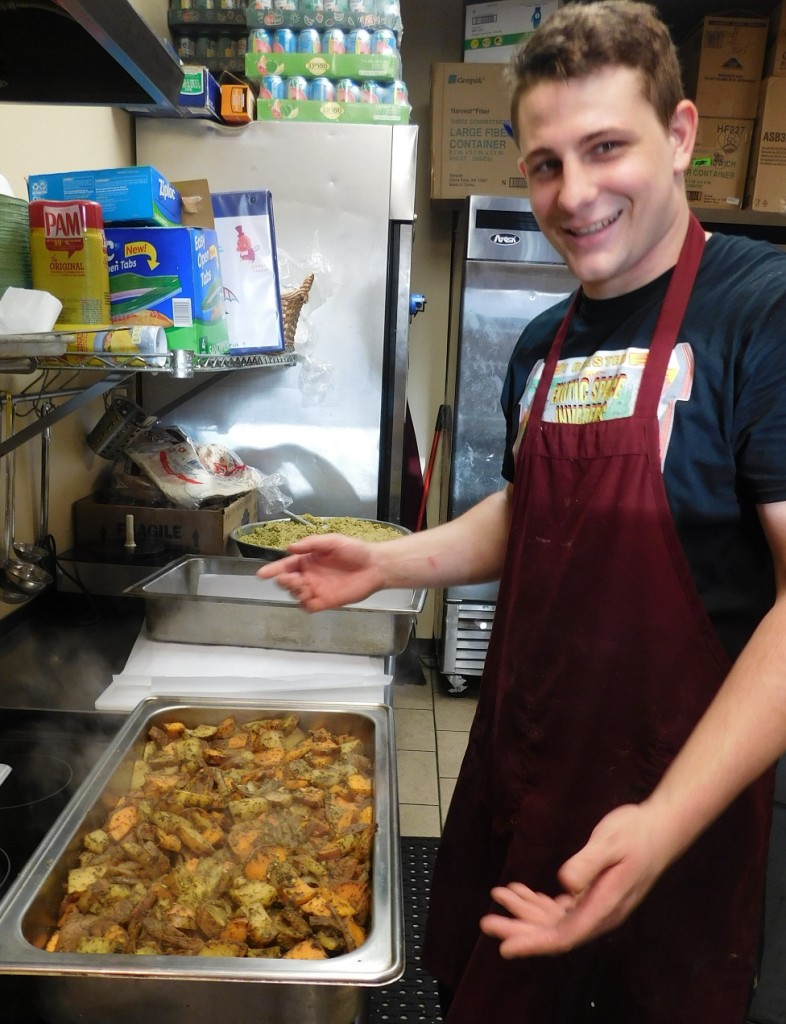 Riley Sullivan and a steaming hot pan of roasted potatoes.