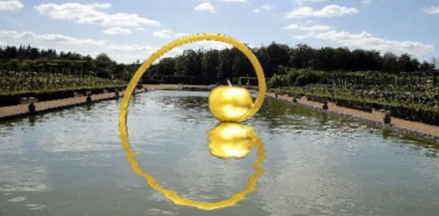 Marcia Raffs monumental sculpture titled "Golden Apple/Golden Spiral."