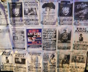 A poster wall draws attention to upcoming events at High Dive.