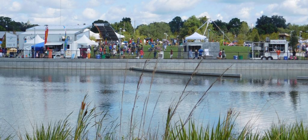 A view from the wetlands area across the pond toward Saturday's festivities at Depot Park.