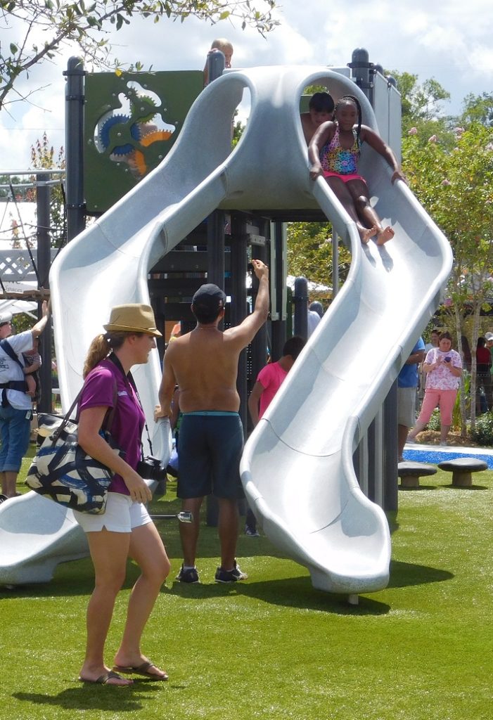 Children enjoy the dueling slides in the play area.