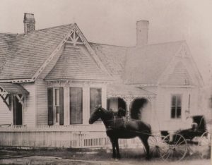 Dr. Sarah Robb in a horse-drawn buggy outside her house, which still stands on Southwest 2nd Avenue.