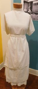 A midwife's uniform from the early 20th century.
