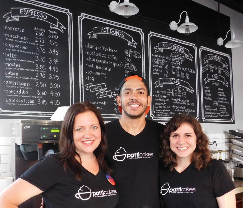 Erin Leigh Patterson, left, with Patticakes employees Josue Benitez and Catherine Caple. Photo by Gainesville Downtown)